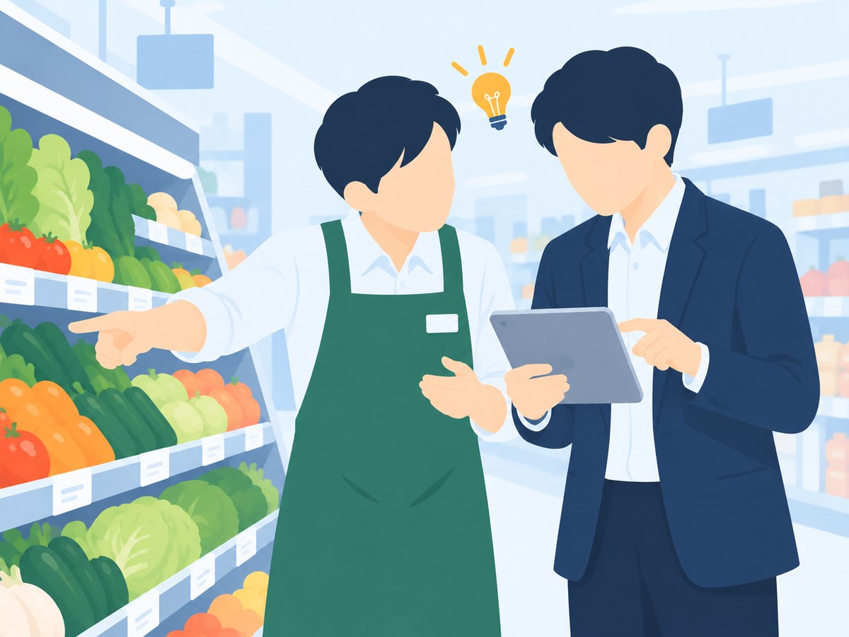 売り場で担当者とアドバイザーがタブレットのデータを見ながら相談するイメージ